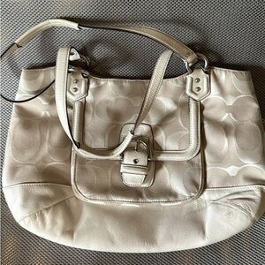 529. Coach purse white logo